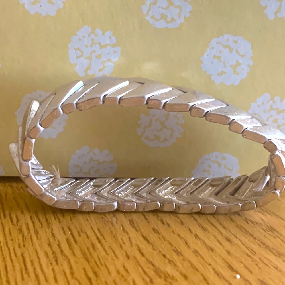 Silver, one size, gently used bracelet. Stretchy and will fit most wrists.